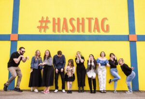 social media managers making funny faces to show the chaos side of the hashtag explore pages on social media and why keywords are what draws people in instead