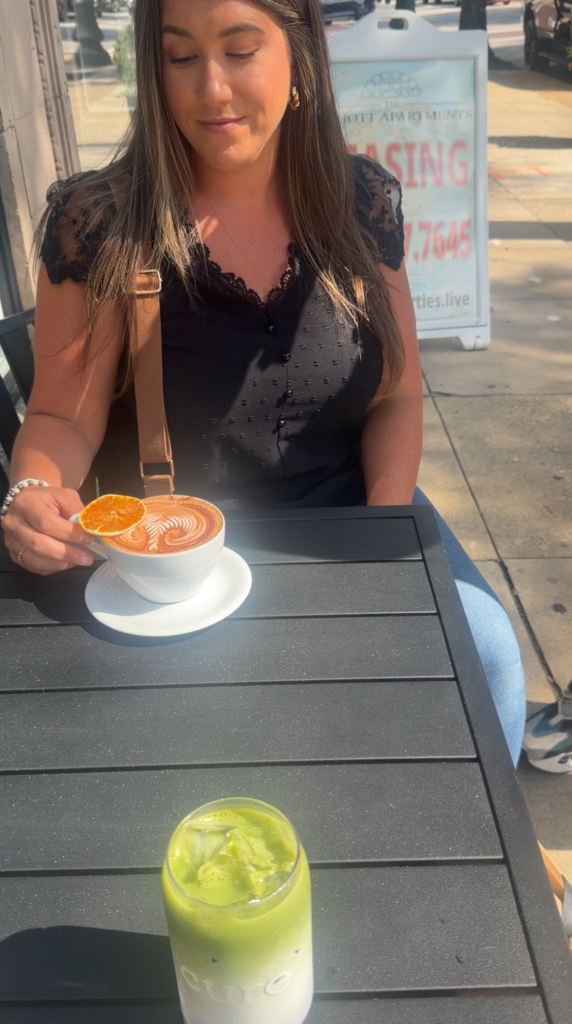 enjoying a coffee at cure suffolk outside